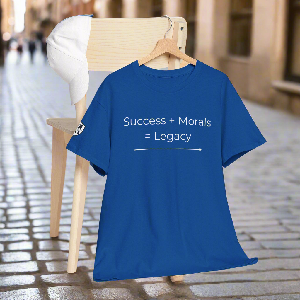 Blue t-shirt with 'Success + Morals = Legacy' text on a hanger outdoors.